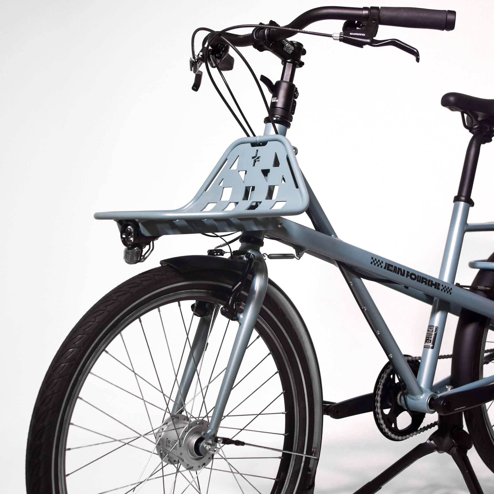 velo bleu de profil sur fond blanc